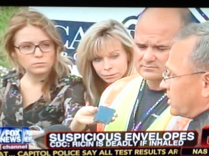 Megan Stewart on the national Fox News Channel while interviewing the Phoenix Fire and Police Chiefs after a "suspicious package" threat was called into Ariz. Senator Jeff Flake's office.